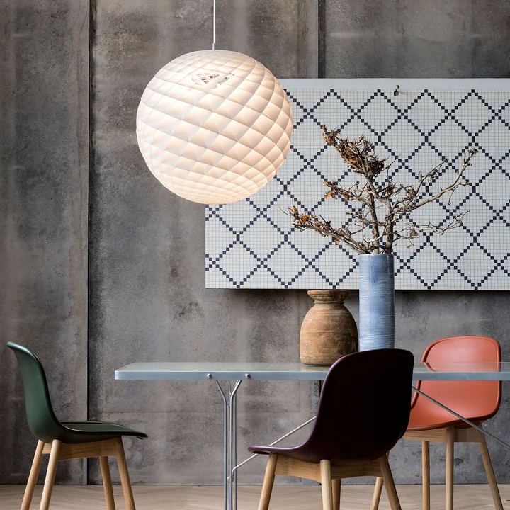 Sculptural pendant lamp above the dining table