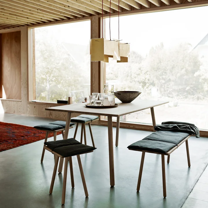The Georg Dining table from Skagerak in a bright, large dining room