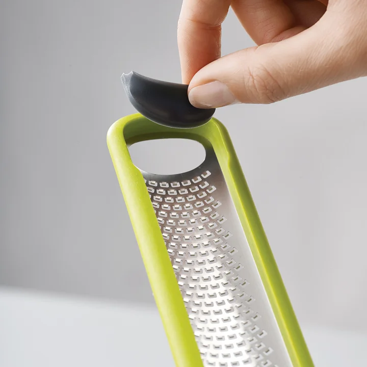 Handi-zest mini grater with blades wiper
