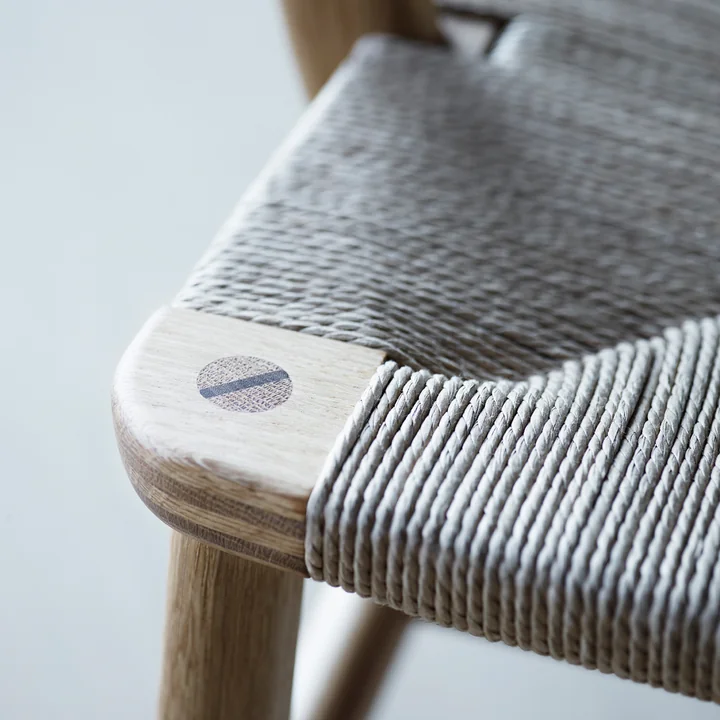 The woven seat of the CH22 chair from Carl Hansen