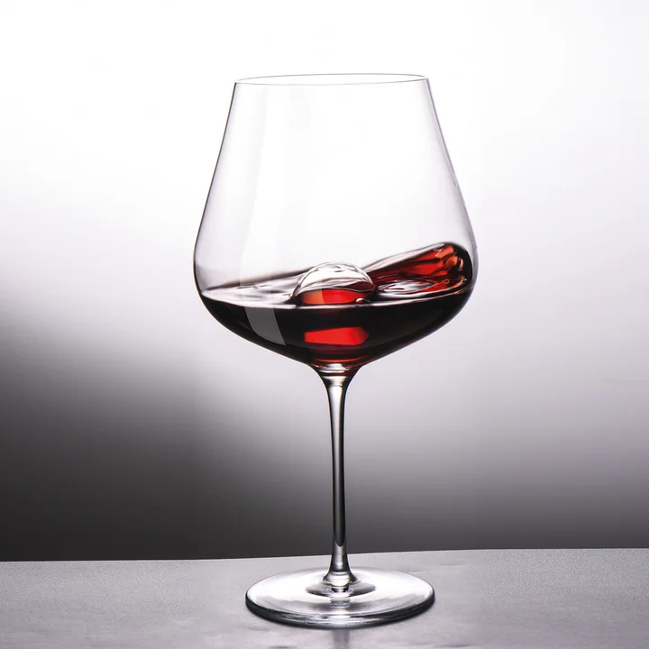 Red wine glass with glass decanting ball