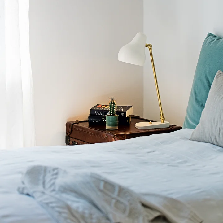 VL38 LED table lamp from Louis Poulsen on the nightstand next to the bed