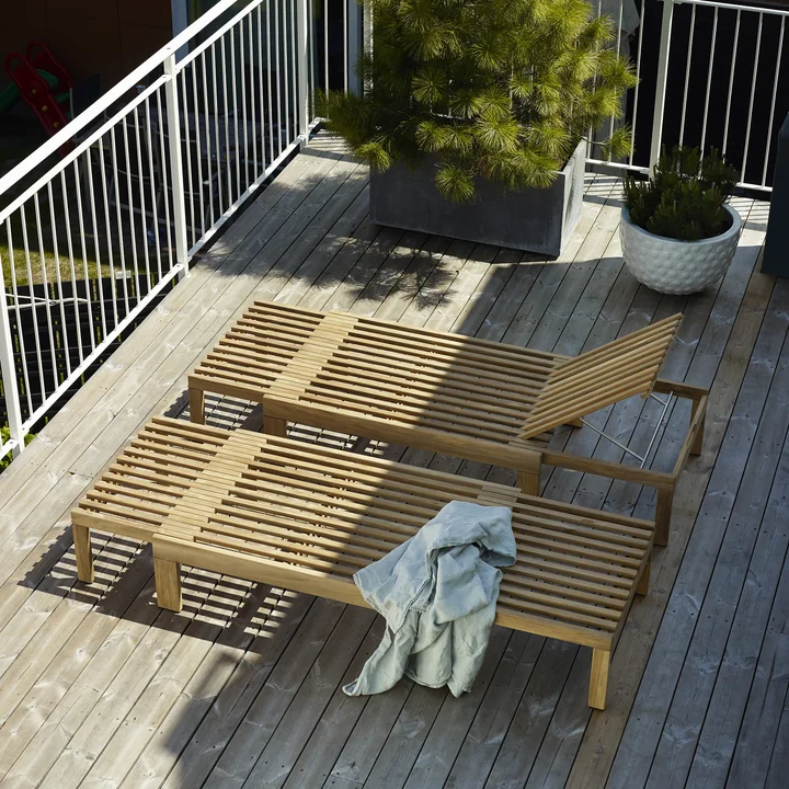 The Riviera Loungers from Skagerak on a wooden balcony