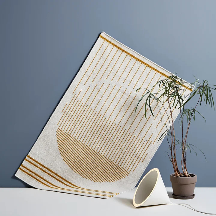 Raining Circle carpet and Annular LED pendant light from Woud