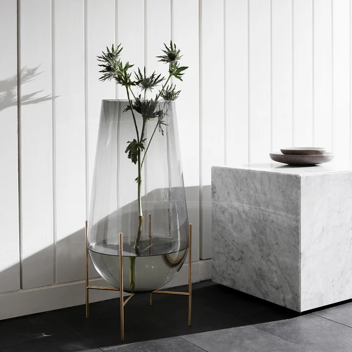 Échasse vase and Plinth Cubic Side table from Audo
