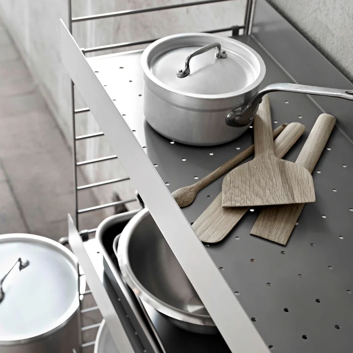 Metal shelf with high edge from String