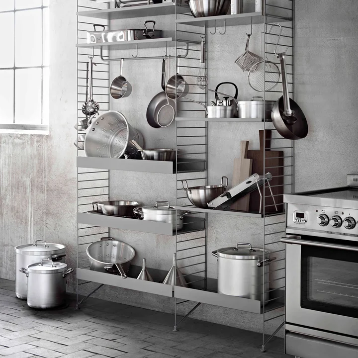 String shelving system with metal shelves and accessories in the kitchen