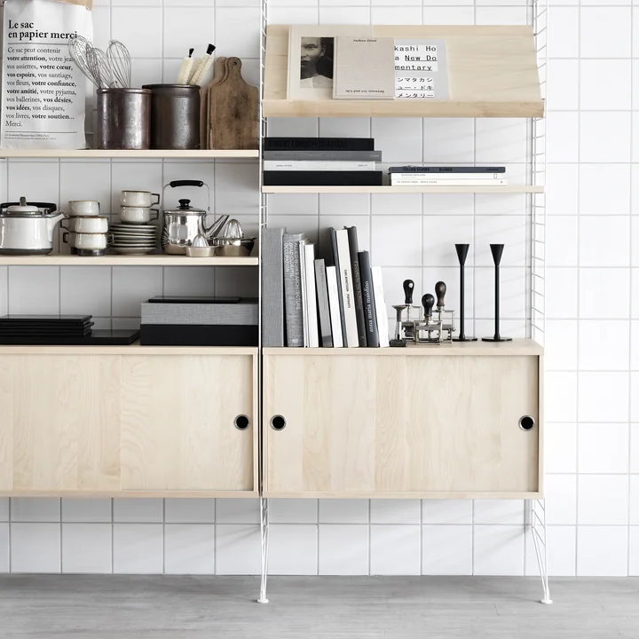 Cupboard module with sliding doors from String Ash with magazine shelf