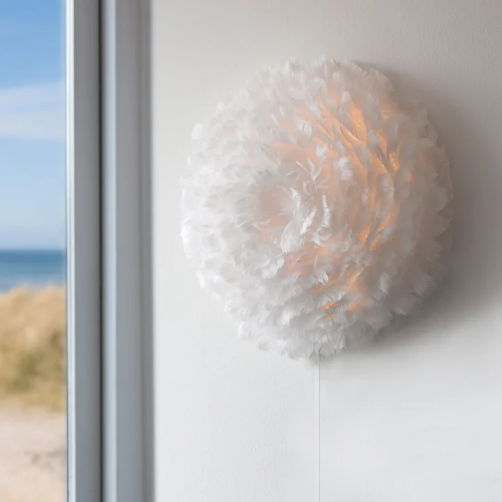Eos Up Ceiling and wall lamp from Umage in Créme on the wall