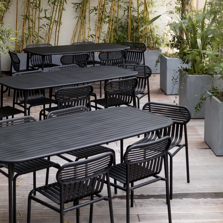 Black tables and chairs from the Week-End series by Petite Friture on the terrace