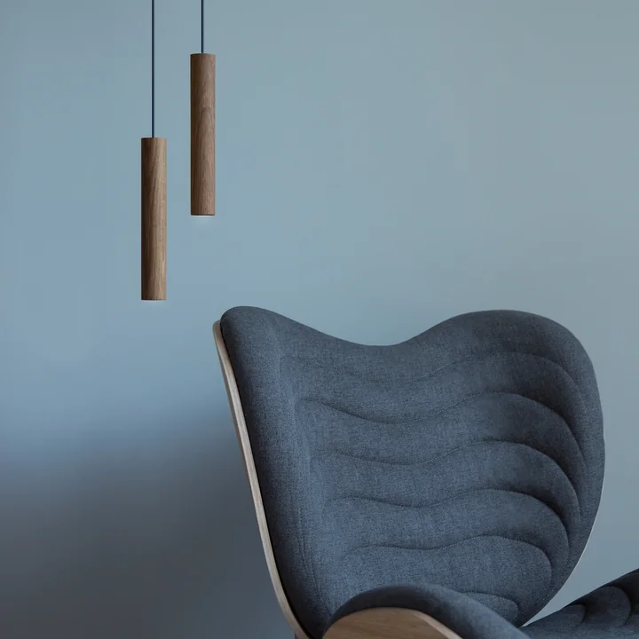 The Umage - Chimes Pendant lamp LED next to the armchair