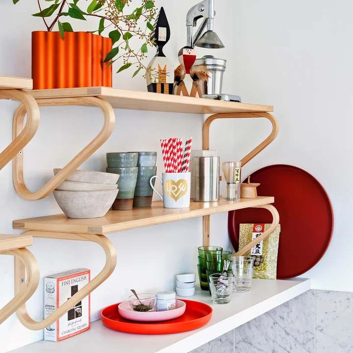 Artek wall shelf with home complements of Vitra