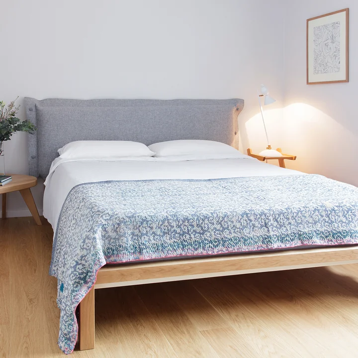 Pure bed with upholstered headboard from Hans Hansen