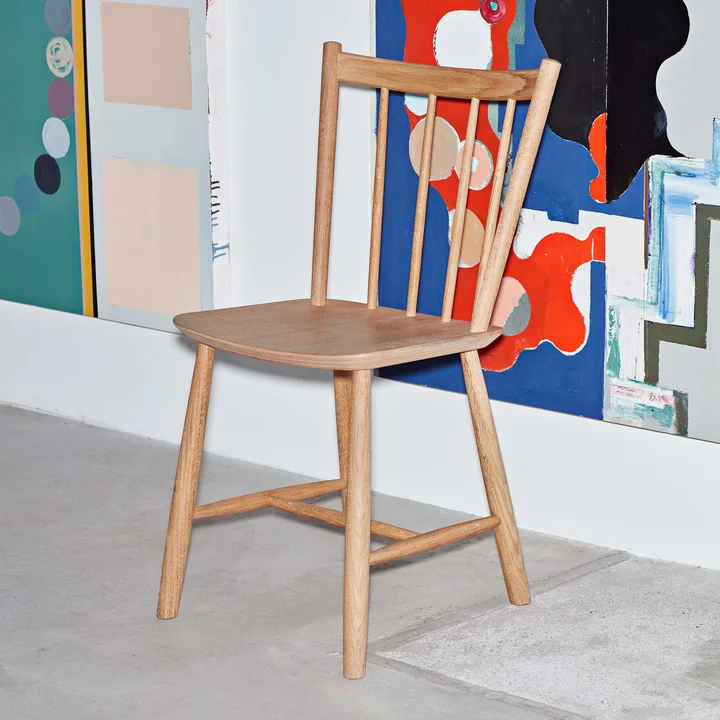 The HAY - J41 Chair in oiled oak placed individually in the room