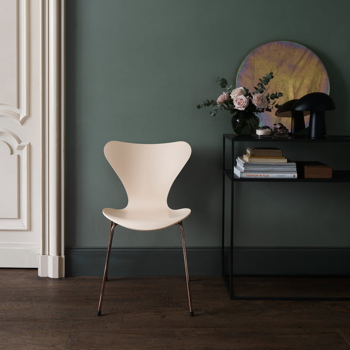 The Fritz Hansen - Night Owl Table lamp stylishly placed on the side table