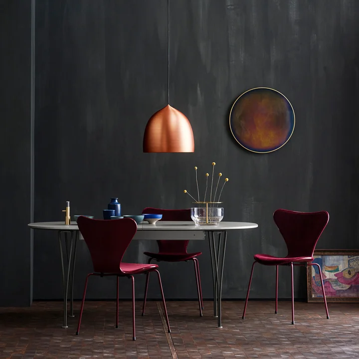 The Fritz Hansen - Suspence pendant lamp arranged above the table