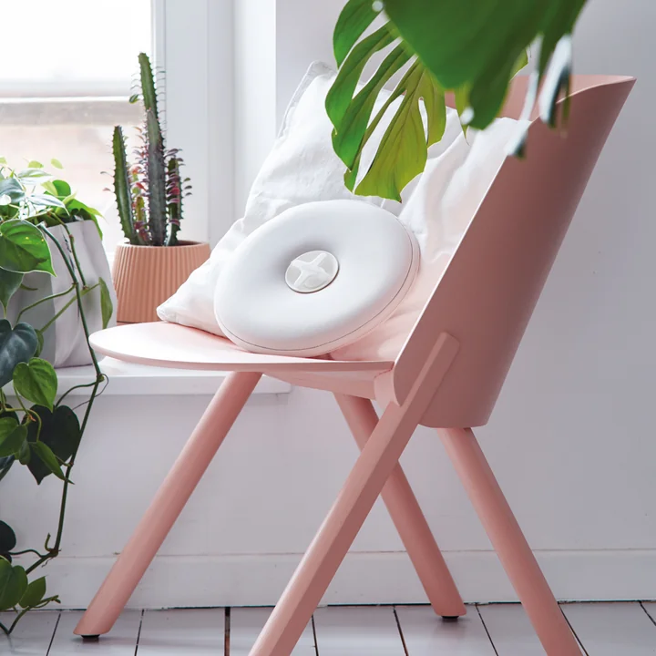 Pill Hot water bottle from Authentics in white-grey on the chair