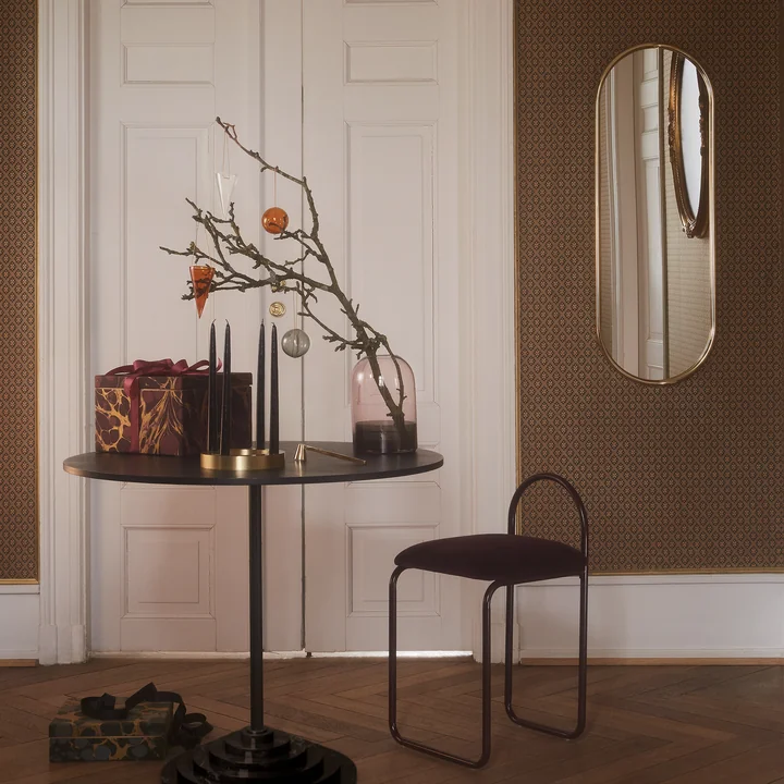 Angui Wall mirror in gold from AYTM together with table and chair
