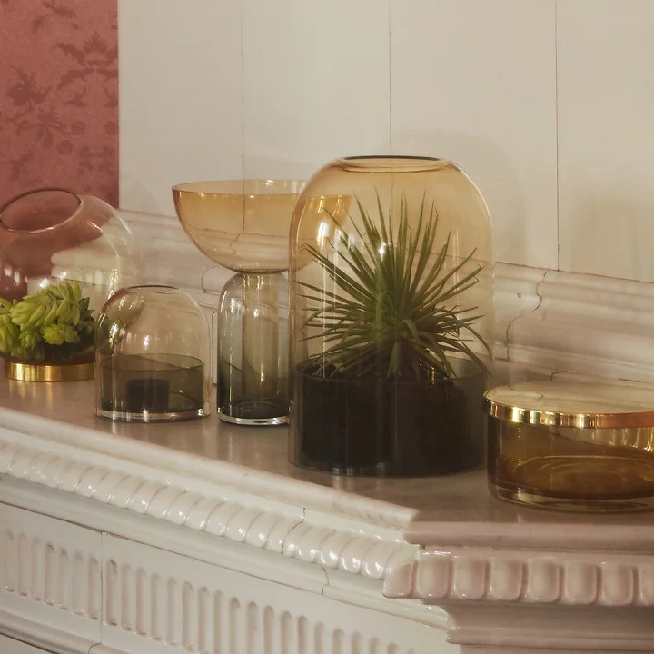 Tota lantern in amber and Torus vase in black / amber from AYTM on the ledge