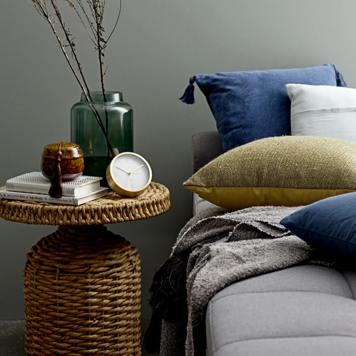 Camo side table woven by Bloomingville, Ø 47 x H 47 cm in nature next to the bed