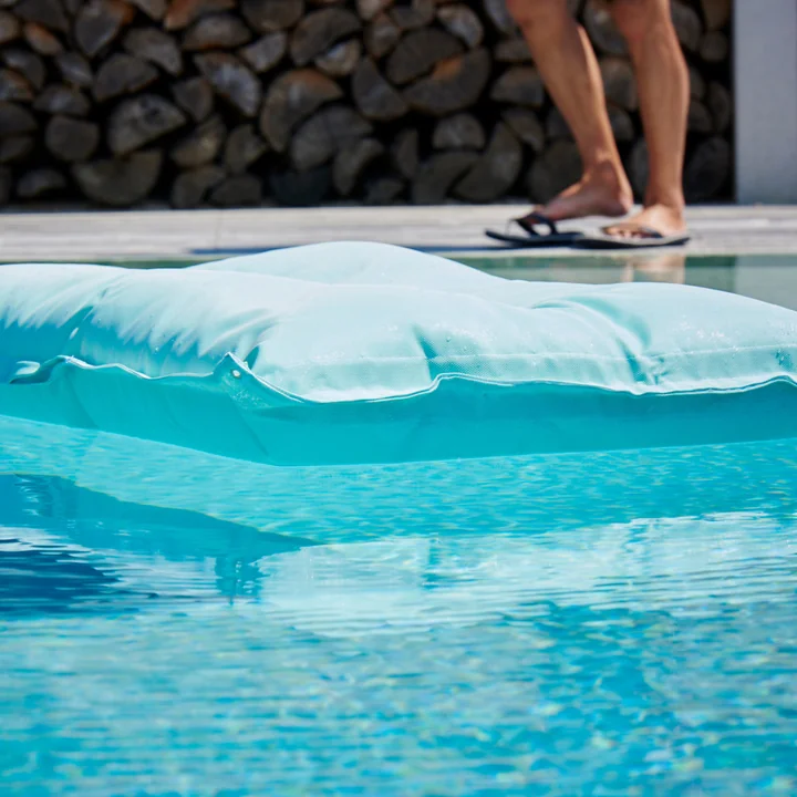 Float swimming cushion from Fiam in the pool