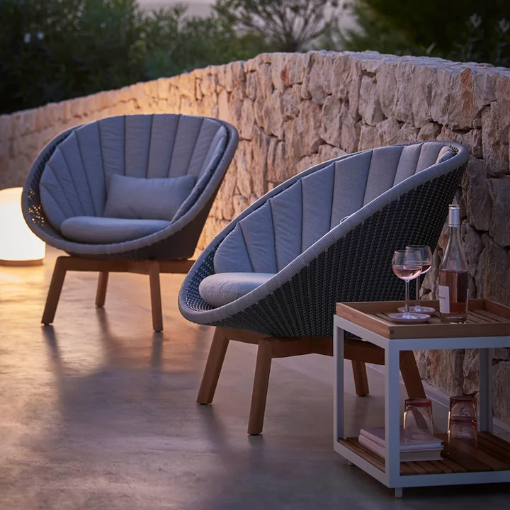 Peacock Lounge chair (5458) from Cane-line in teak / light gray