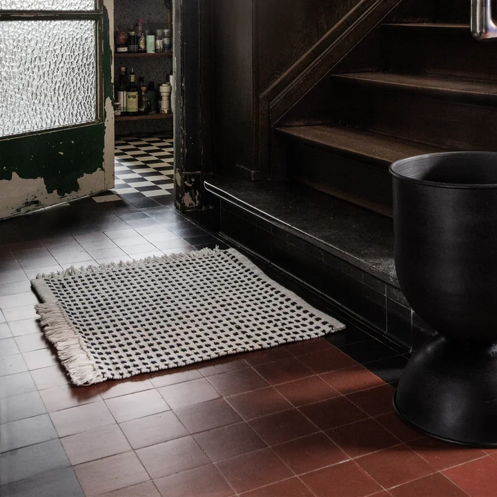 Way Outdoor Mat, 50 x 70 cm in off-white / blue from Ferm Living in front of the stairs