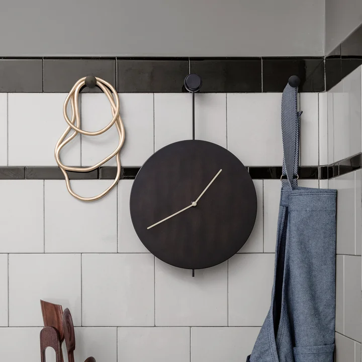 Trace wall clock in black / brass from Ferm Living in the kitchen