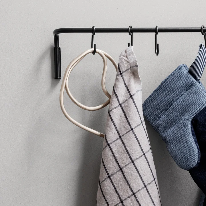 Pond coaster in brass (set of 3) from Ferm Living on hook in the kitchen