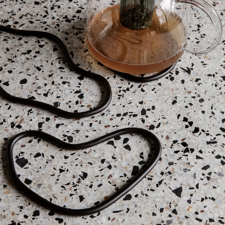 Pond coaster in black (set of 3) from Ferm Living on the table