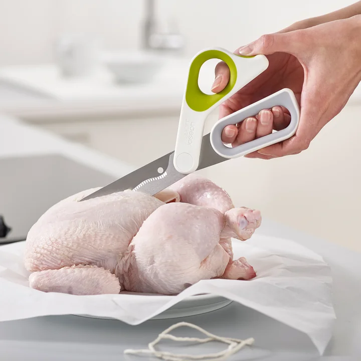 Powergrip kitchen scissors by Joseph Joseph in white / green