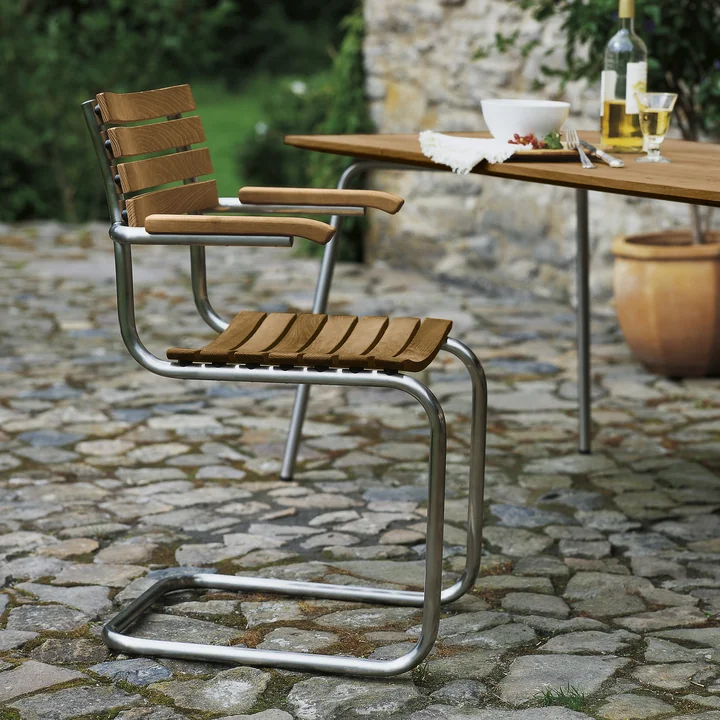 S 40 F Outdoor armchair, round stainless steel tube frame / seat and back Iroko oiled by Thonet on the terrace