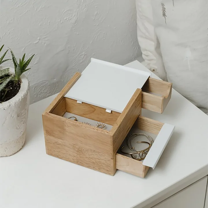 Stowit Mini jewellery box from Umbra in beech / white on the chest of drawers