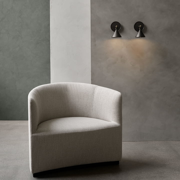 Cast Sconce wall lamp from Audo next to the armchair as a reading lamp