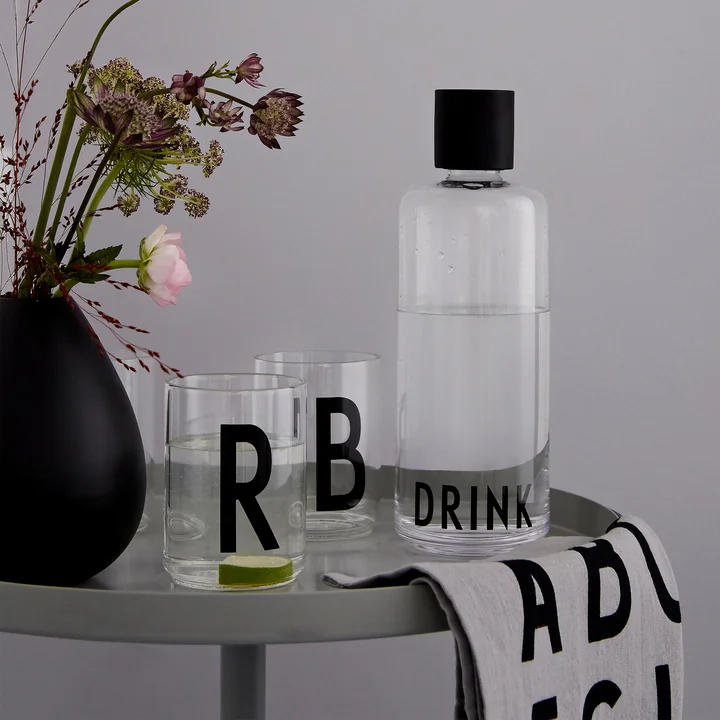 Classic Tea towel and AJ drinking glasses from Design Letters on the table