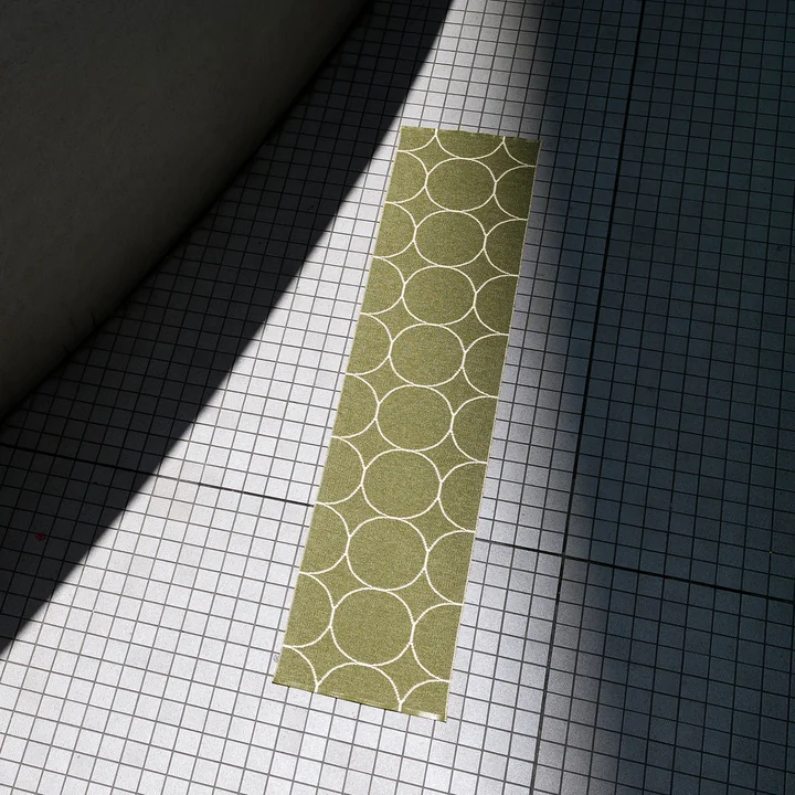 Boo reversible carpet, 70 x 300 cm in dark olive / vanilla from Pappelina 