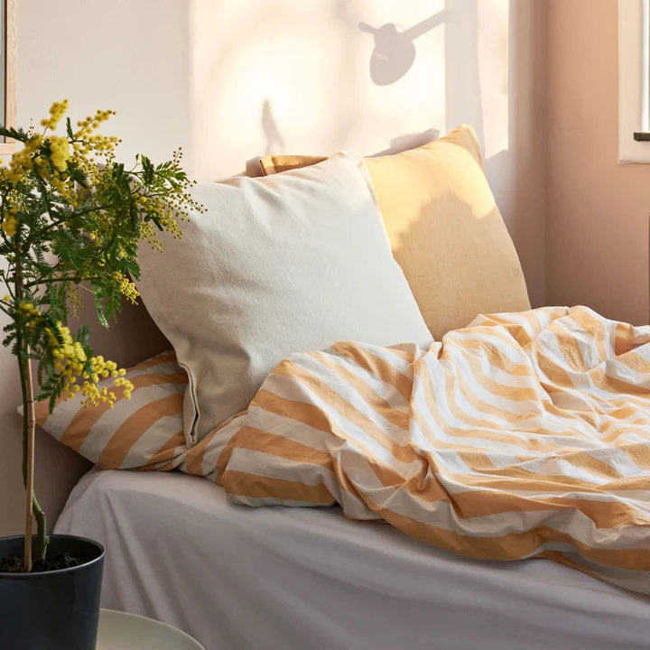 Été bedding in warm yellowwith Plica Tint pillow from HAY