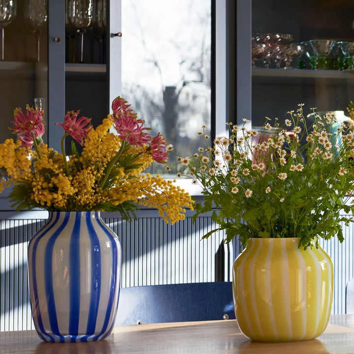 Juice vases with flowers by HAY