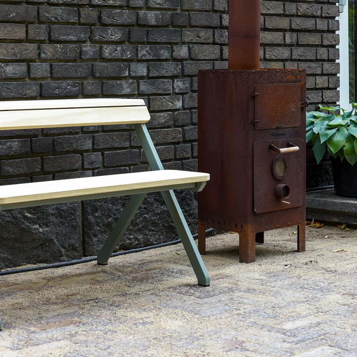 Outdoor steel stove from Weltevree on the terrace in the garden 