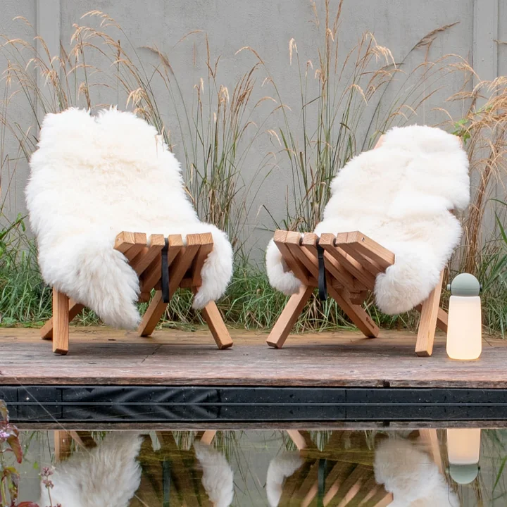 Fieldchair with sheepskin from Weltevree by the pool