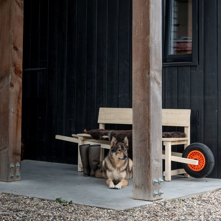 Wheelbench from Weltevree with sheepskin in front of the house