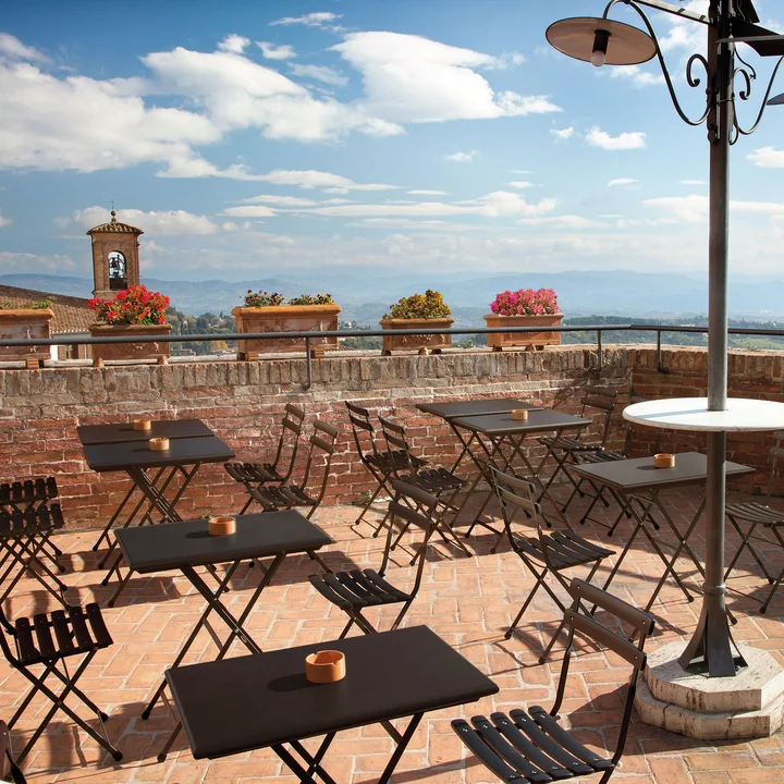 Arc en Ciel Folding table and folding chair from Emu in the café