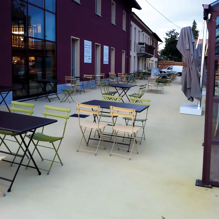 Arc en Ciel folding chair by Emu in the café