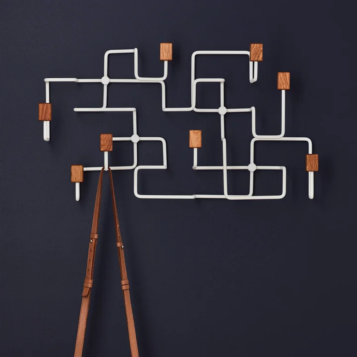 Underground wall wardrobe in oak / white from Gejst on dark wall