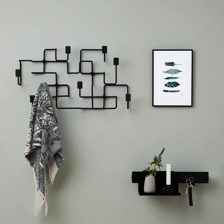 Underground wall wardrobe in black by Gejst on the wall