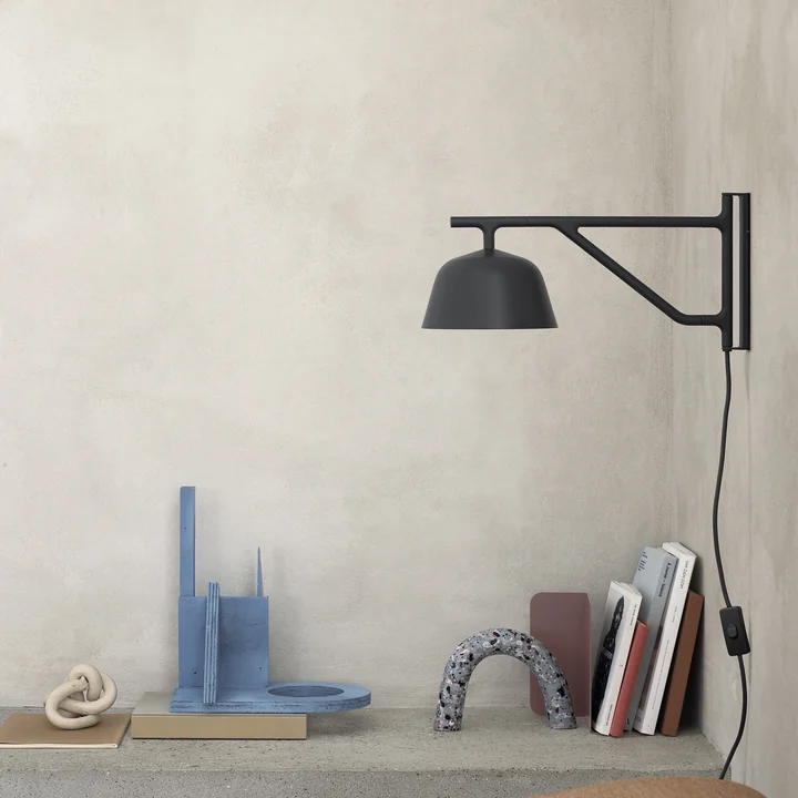 Ambit wall lamp by Muuto above the shelf 