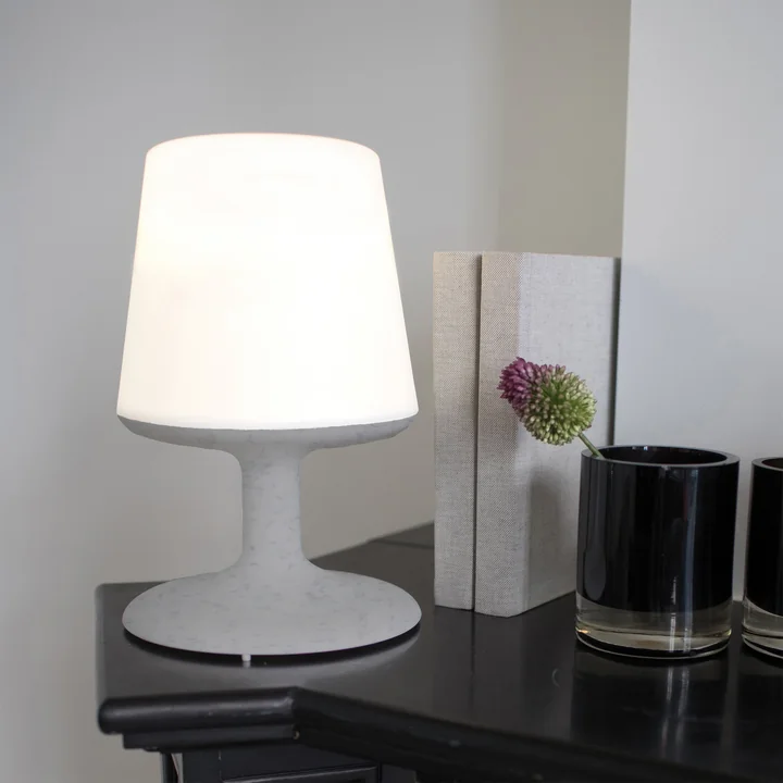 Light to go battery-powered table lamp in organic grey from Koziol on the table 