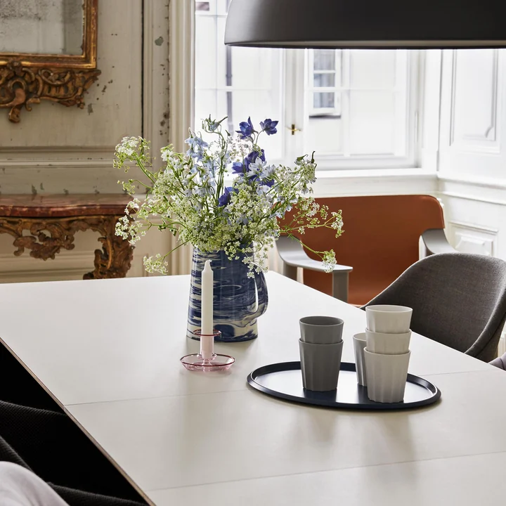 Flare Candlestick from HAY on the table