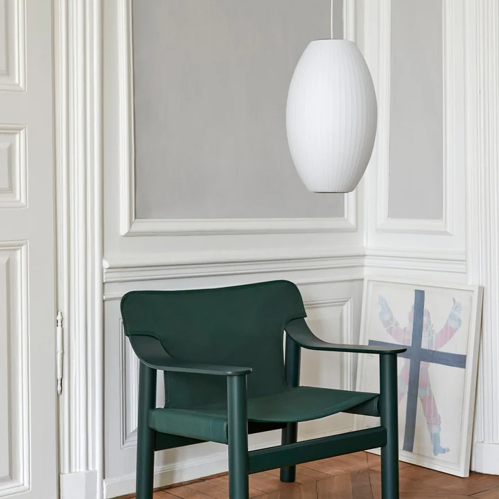 Nelson Cigar Bubble pendant lamp by HAY above the armchair