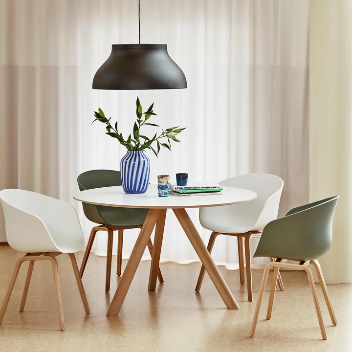 PC pendant light from HAY above the CPH20 dining table with AAC 22 chairs